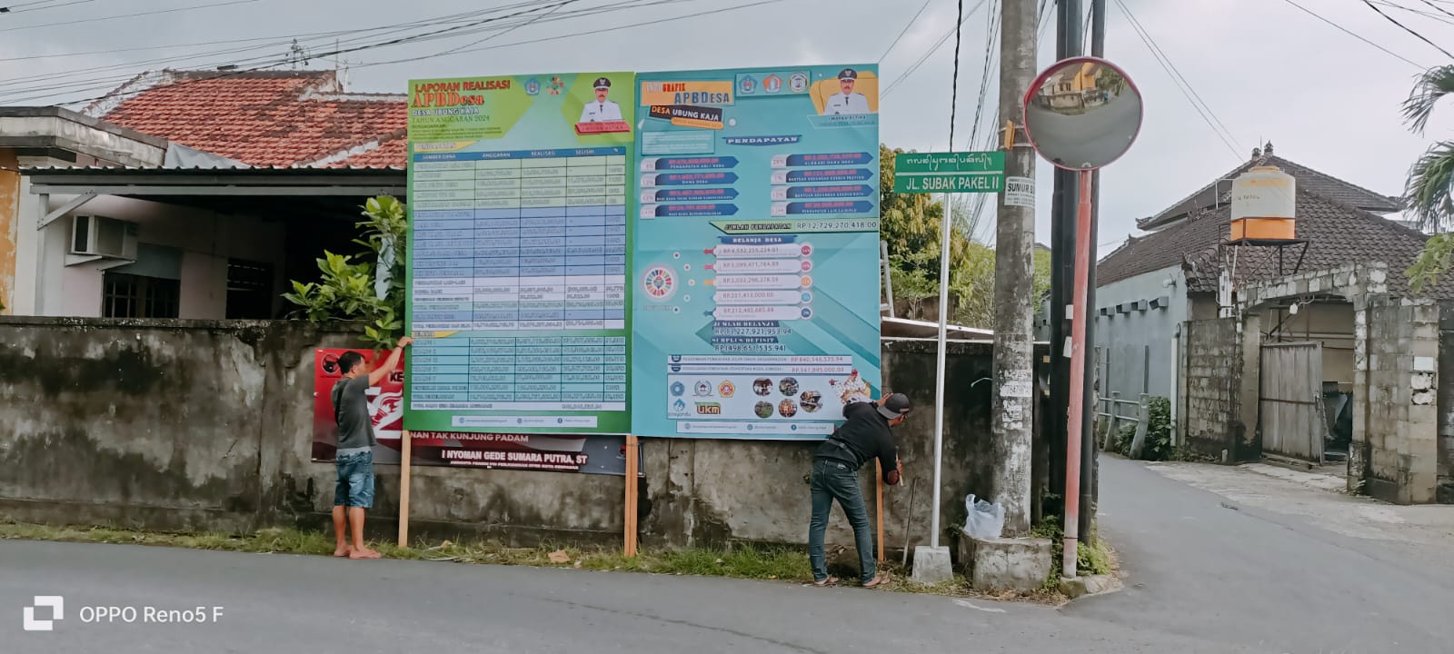Pemasangan Baliho APB Desa Ubung Kaja Tahun 2025 dan Realisasi APB Desa Tahun 2024 di Empat Titik Strategis
